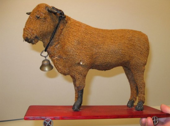 Cow on a plaform