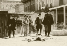 Dead cowboy with men with guns western