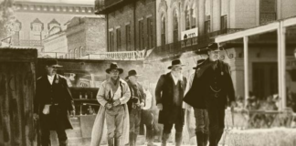 Dead cowboy with men with guns western