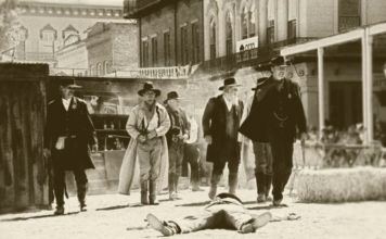 Dead cowboy with men with guns western